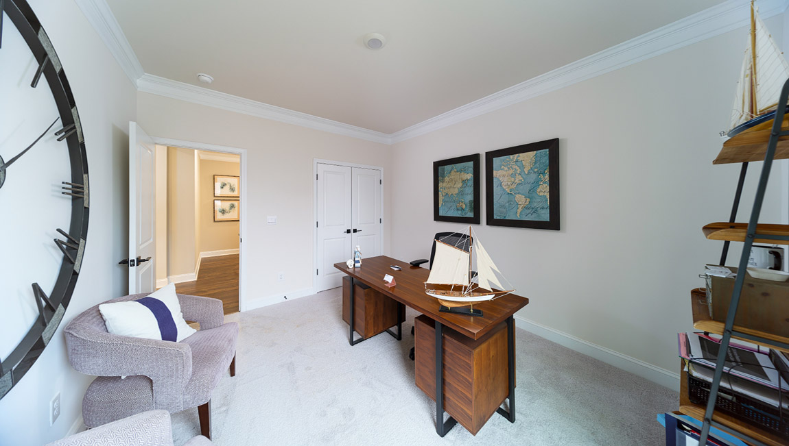 Carpeted bedroom with small window