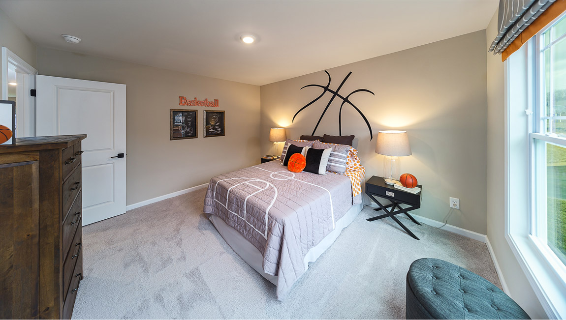 Carpeted bedroom with large window