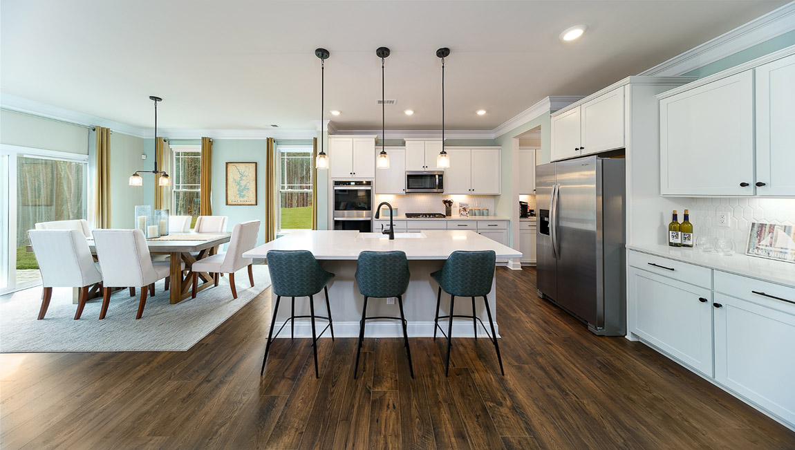 Kitchen and island with white cabinets