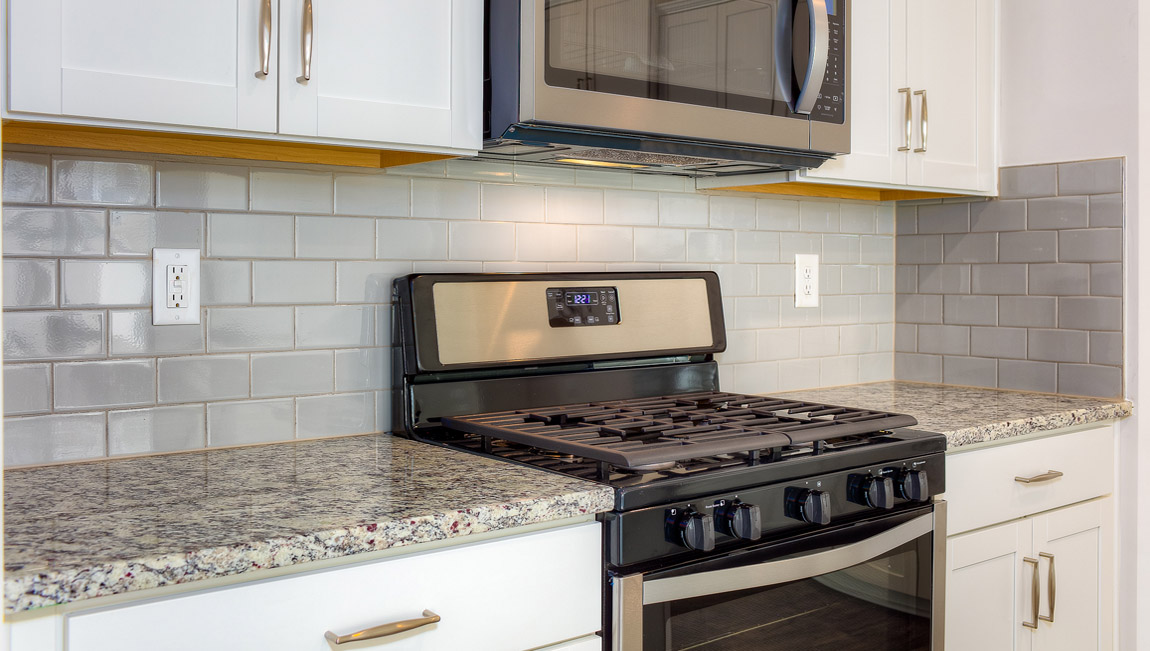 Open kitchen with stainless steel appliances and island