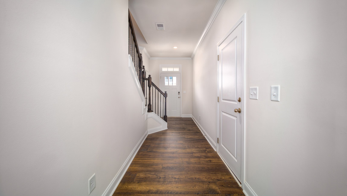 Welcoming foyer with view of stairs