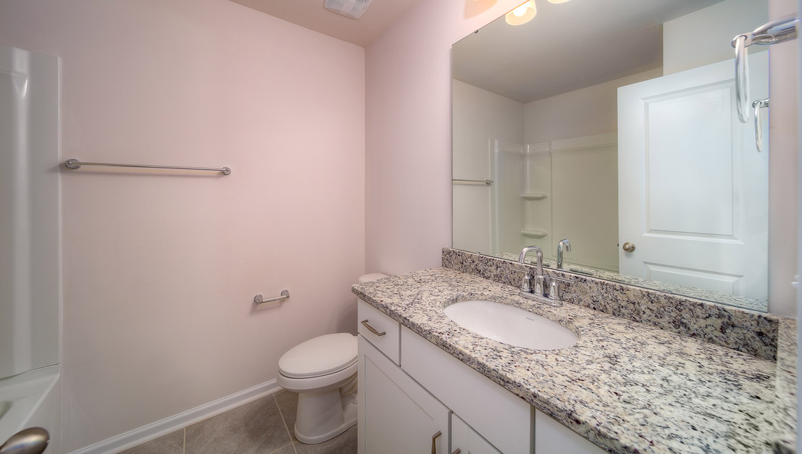 Bathroom with vanity and bathtub