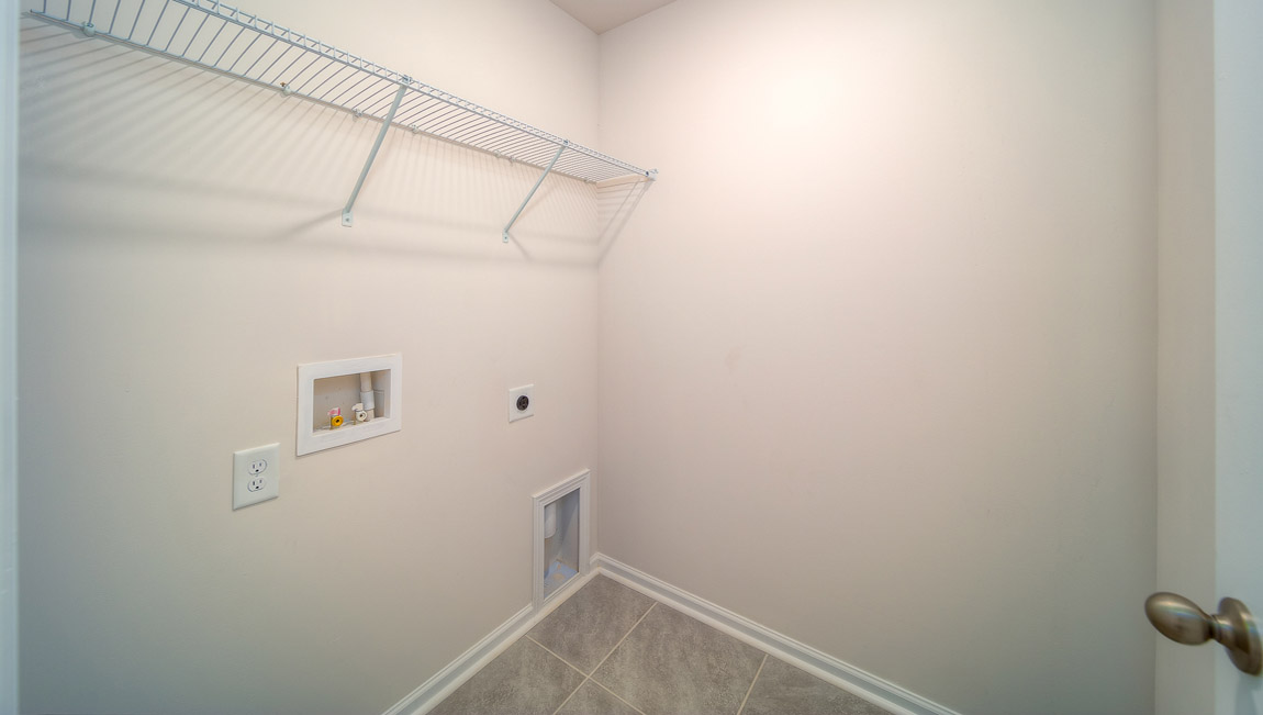 Laundry room with shelving