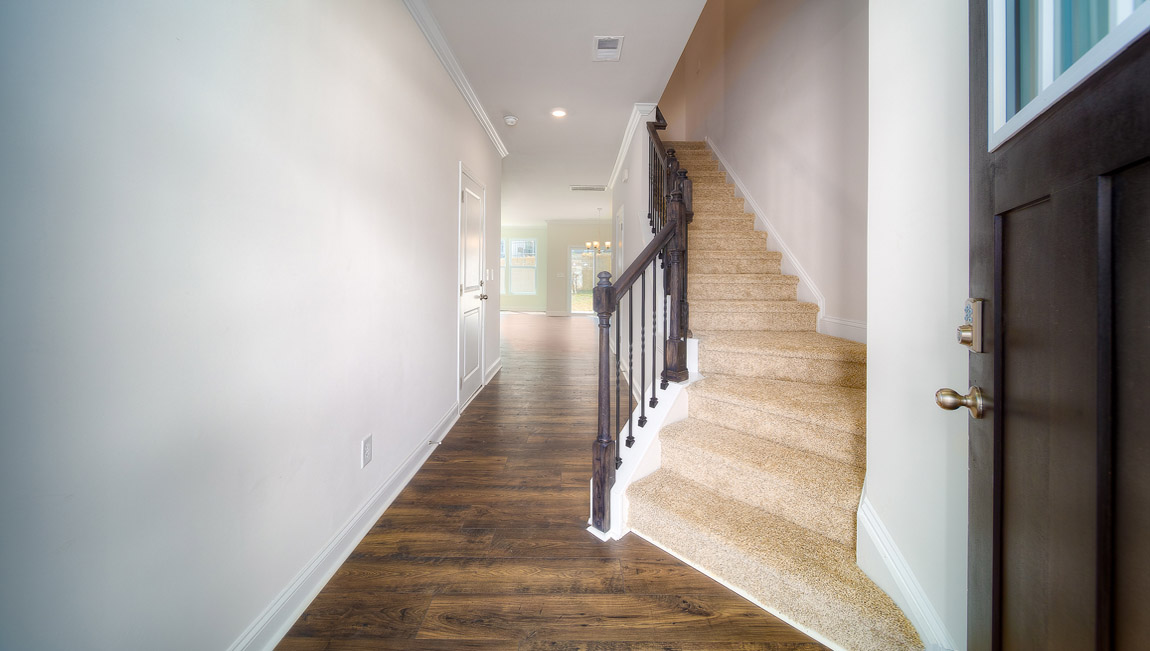Hallway with view of stairs