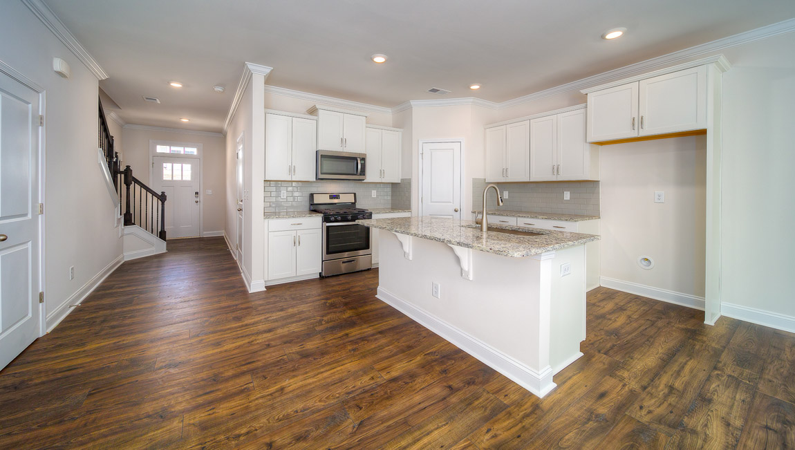 Open kitchen with stainless steel appliances and island