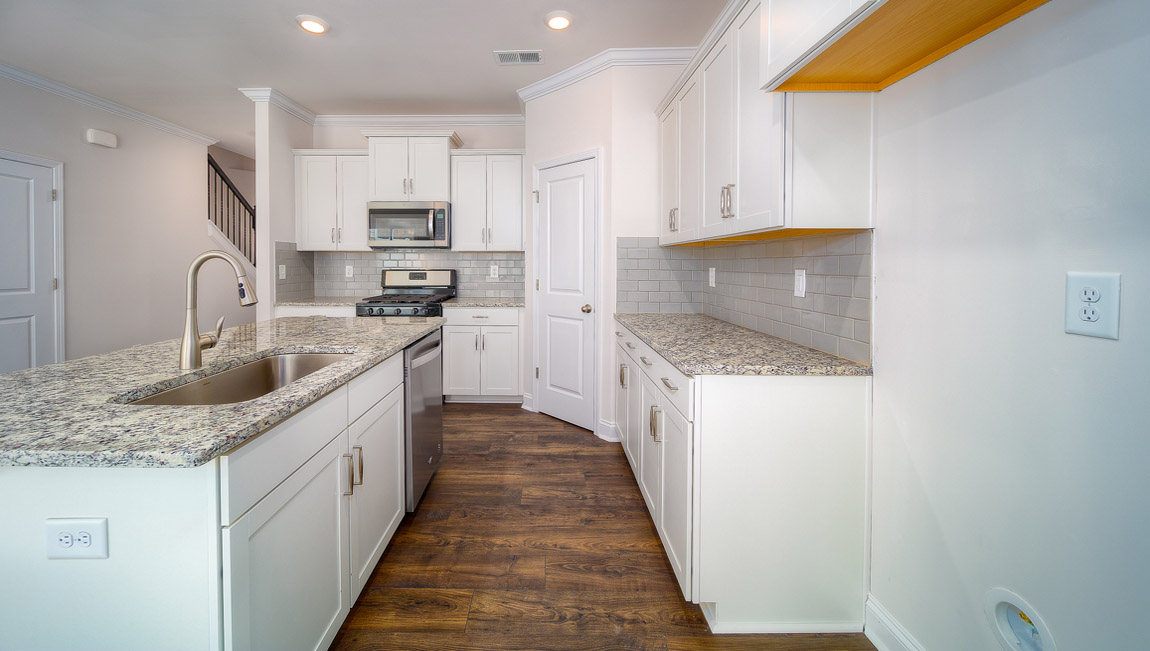 Open kitchen with stainless steel appliances and island