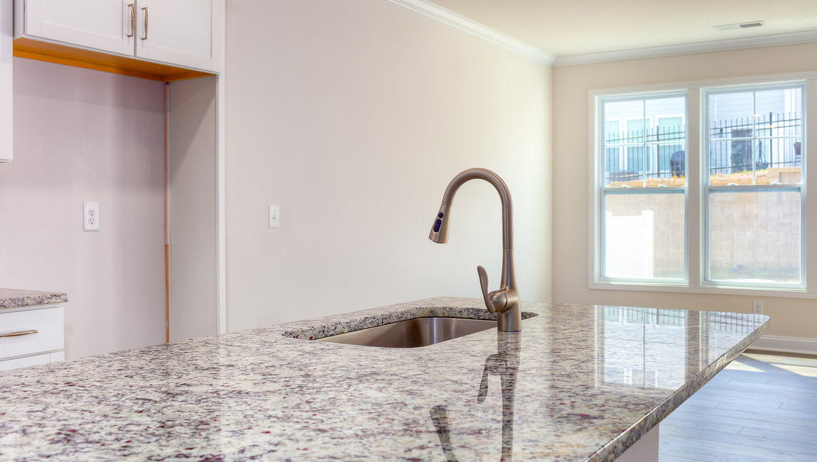 Open kitchen with stainless steel appliances and island