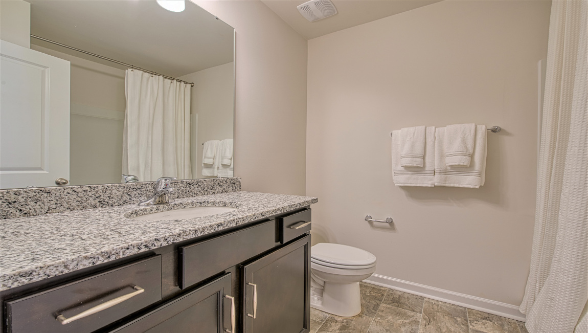 Bathroom with dual vanity and bathtub
