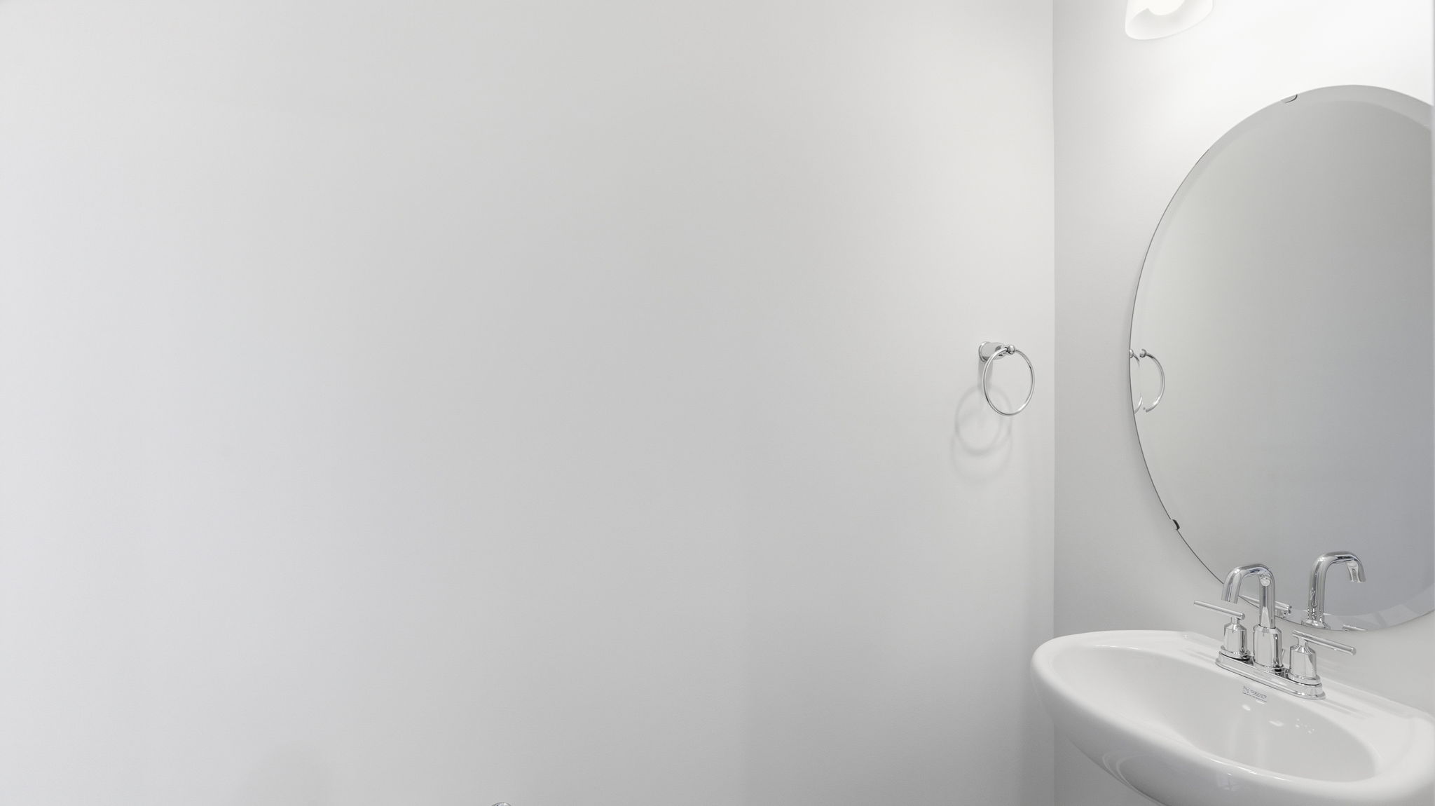 Powder room with single sink and mirror