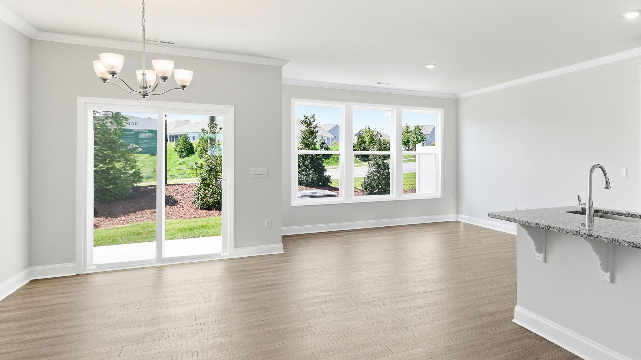 Open concept kitchen with large island and stainless steel appliances