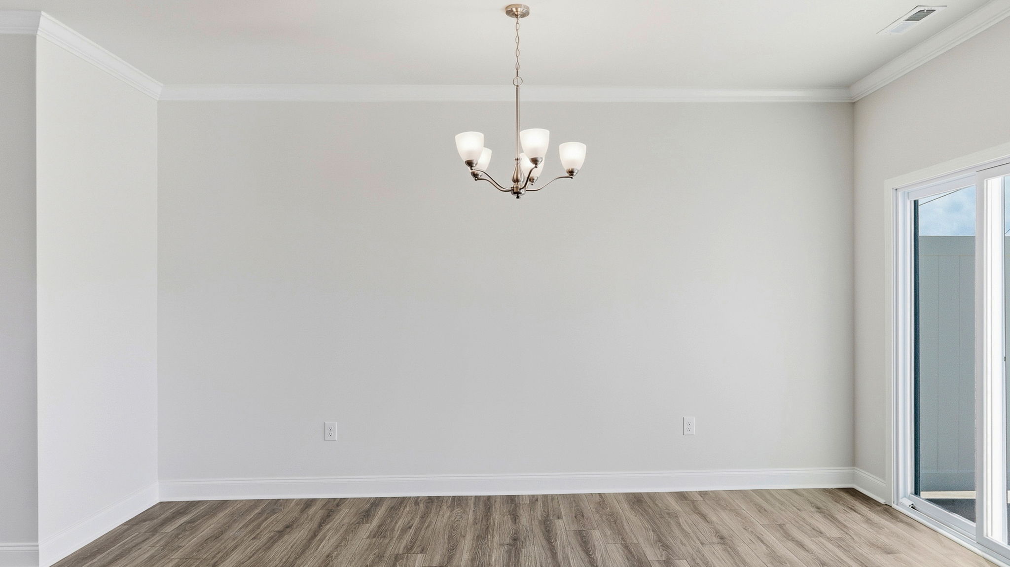 Open living room area with large windows and sliding glass doors