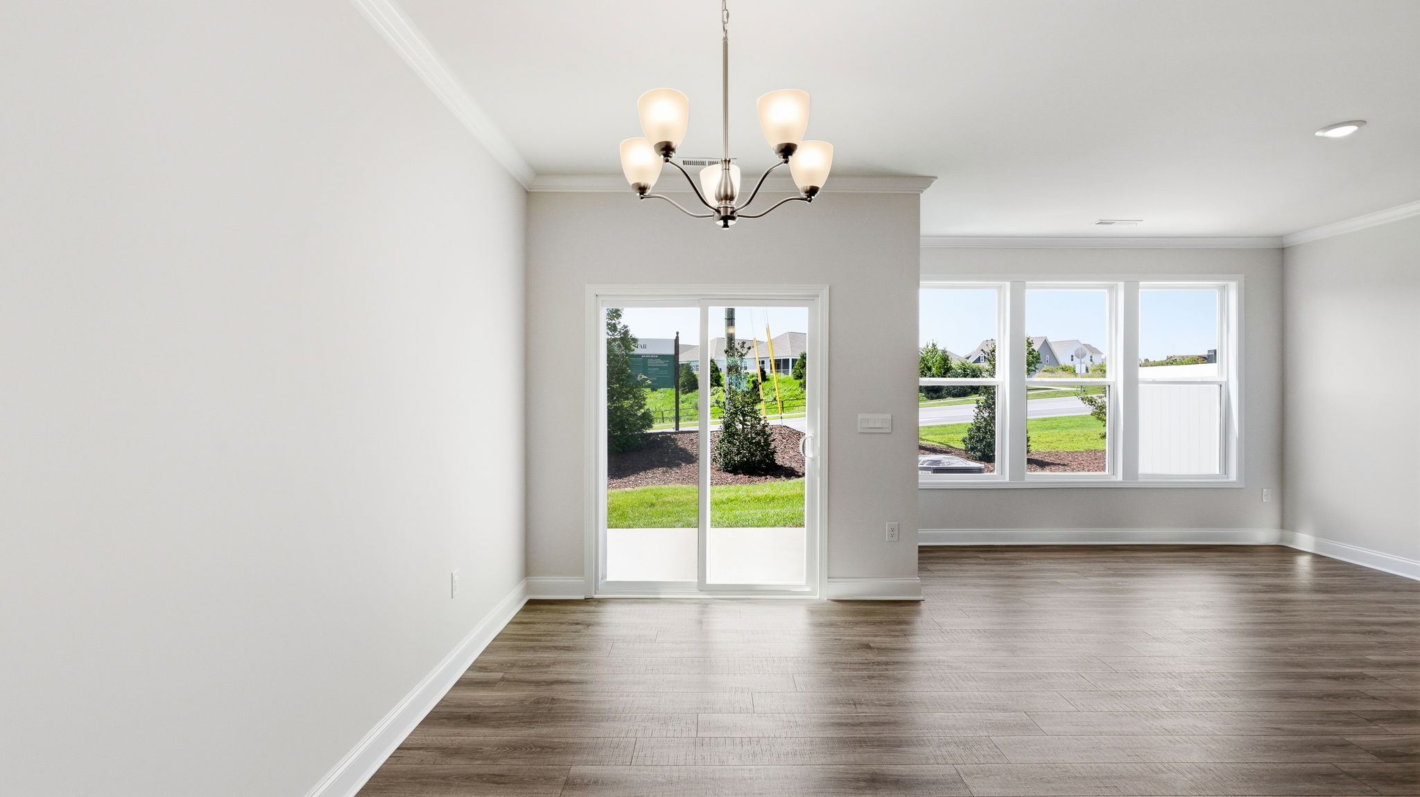 Open living area with large windows and sliding glass doors