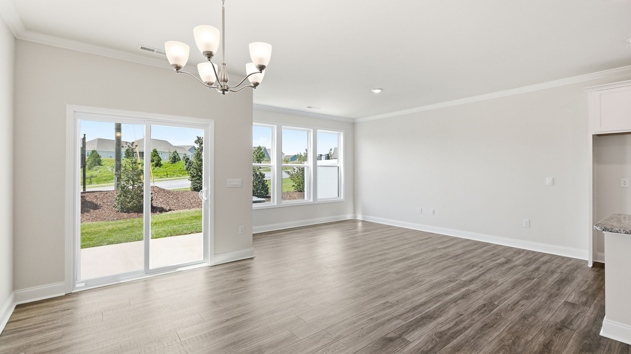 Open dining area with sliding glass doors to back patio
