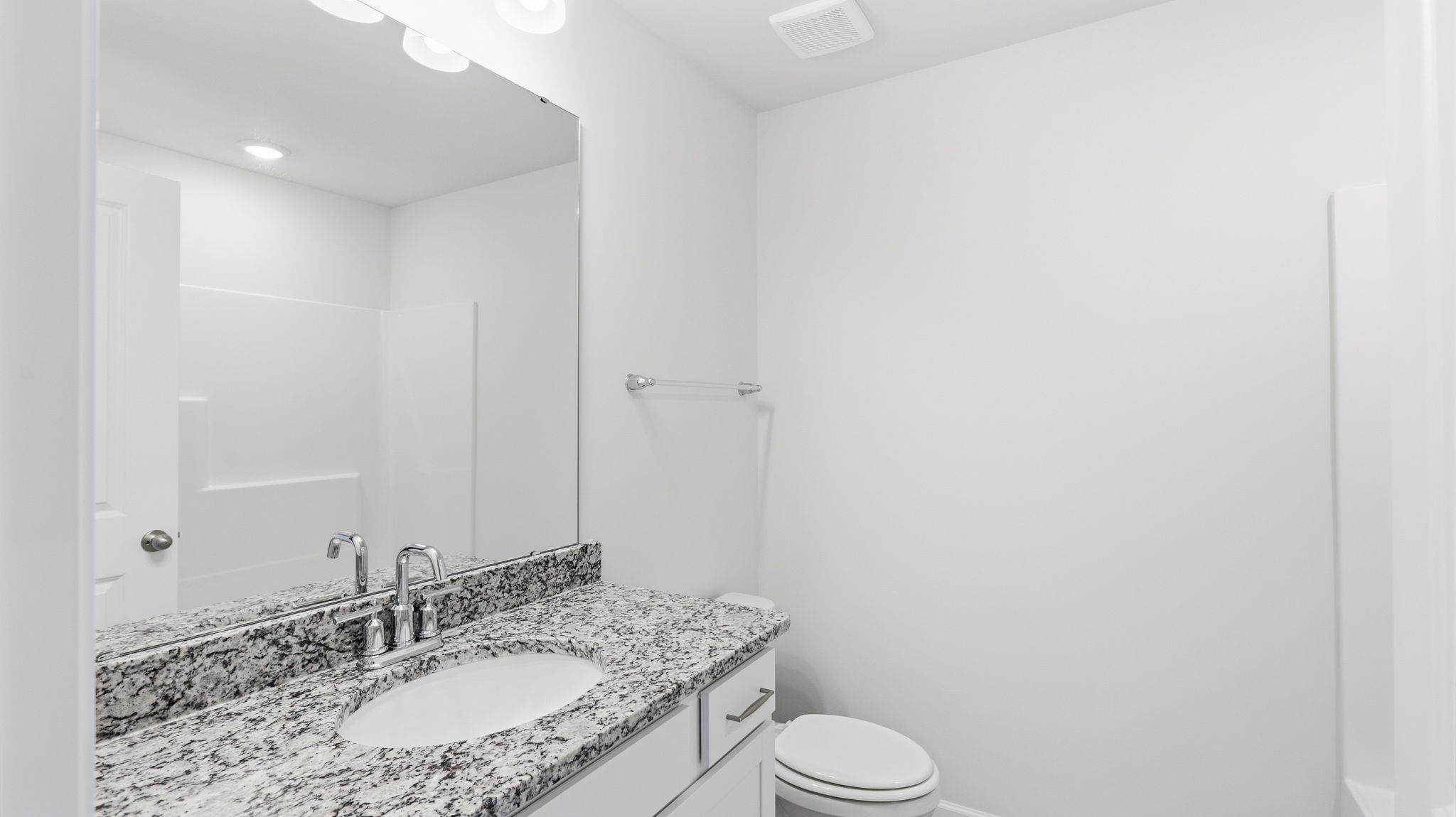 Bathroom with vanity and bathtub