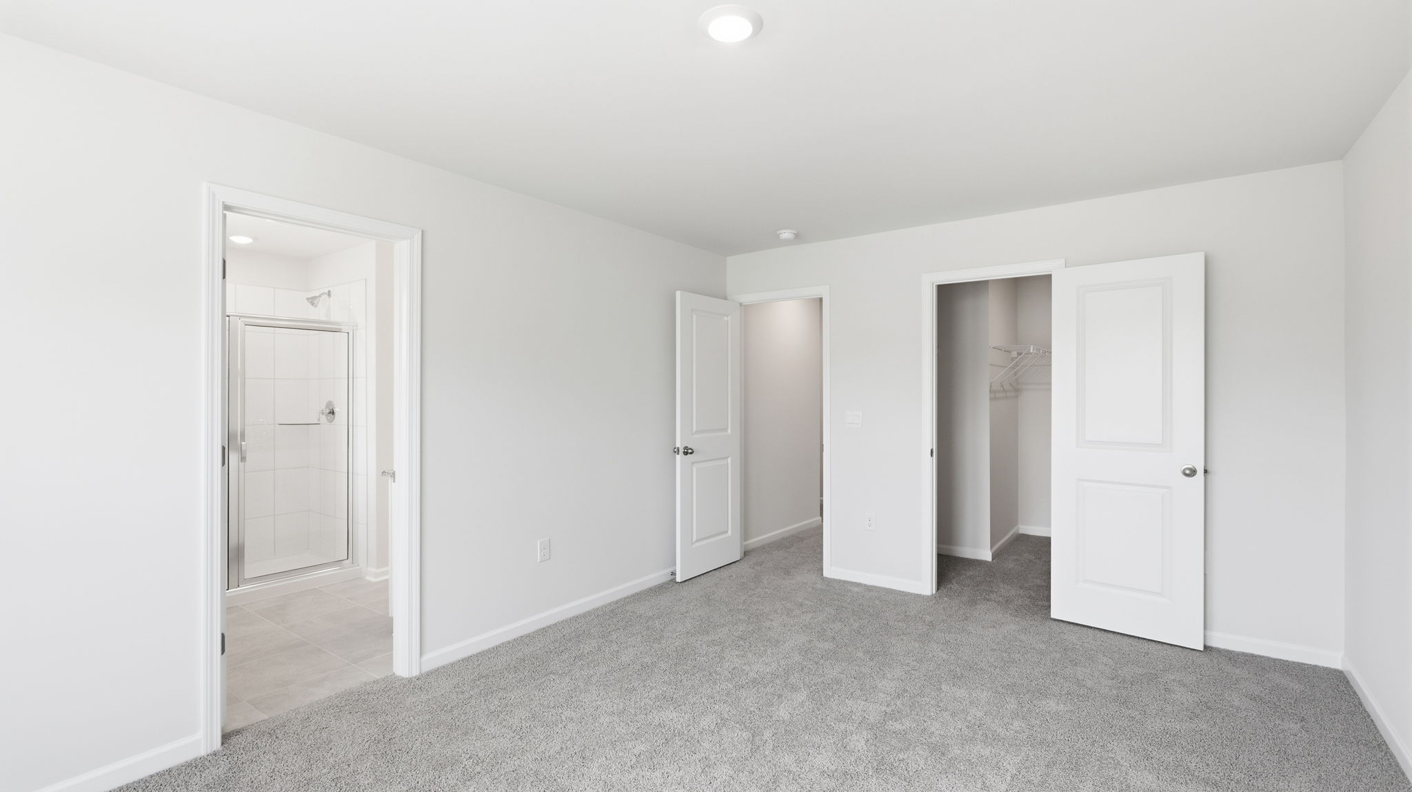 Primary bedroom with attached bathroom