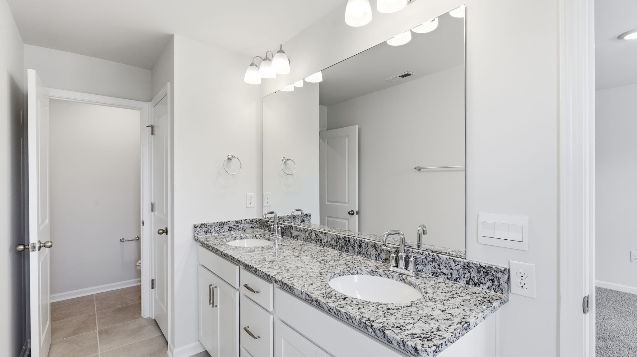Primary bathroom with dual vanity