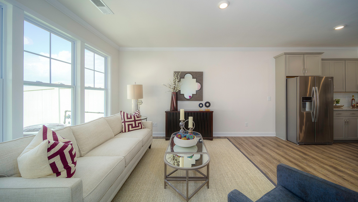 Carpeted living room with large windows