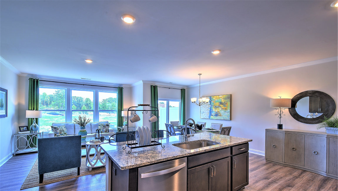 Open kitchen with island and stainless steel appliances