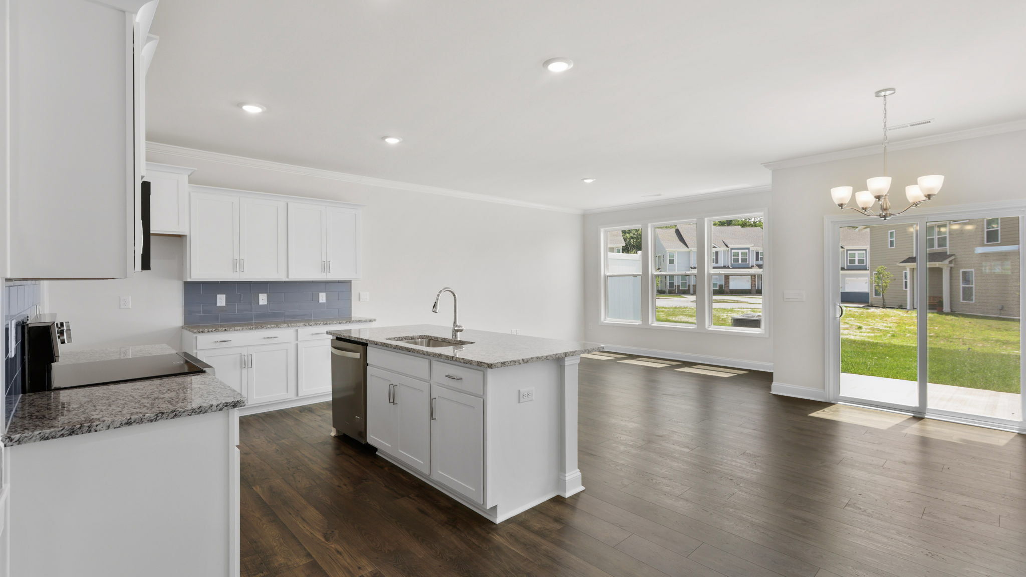 Open concept kitchen with large island and stainless steel appliances