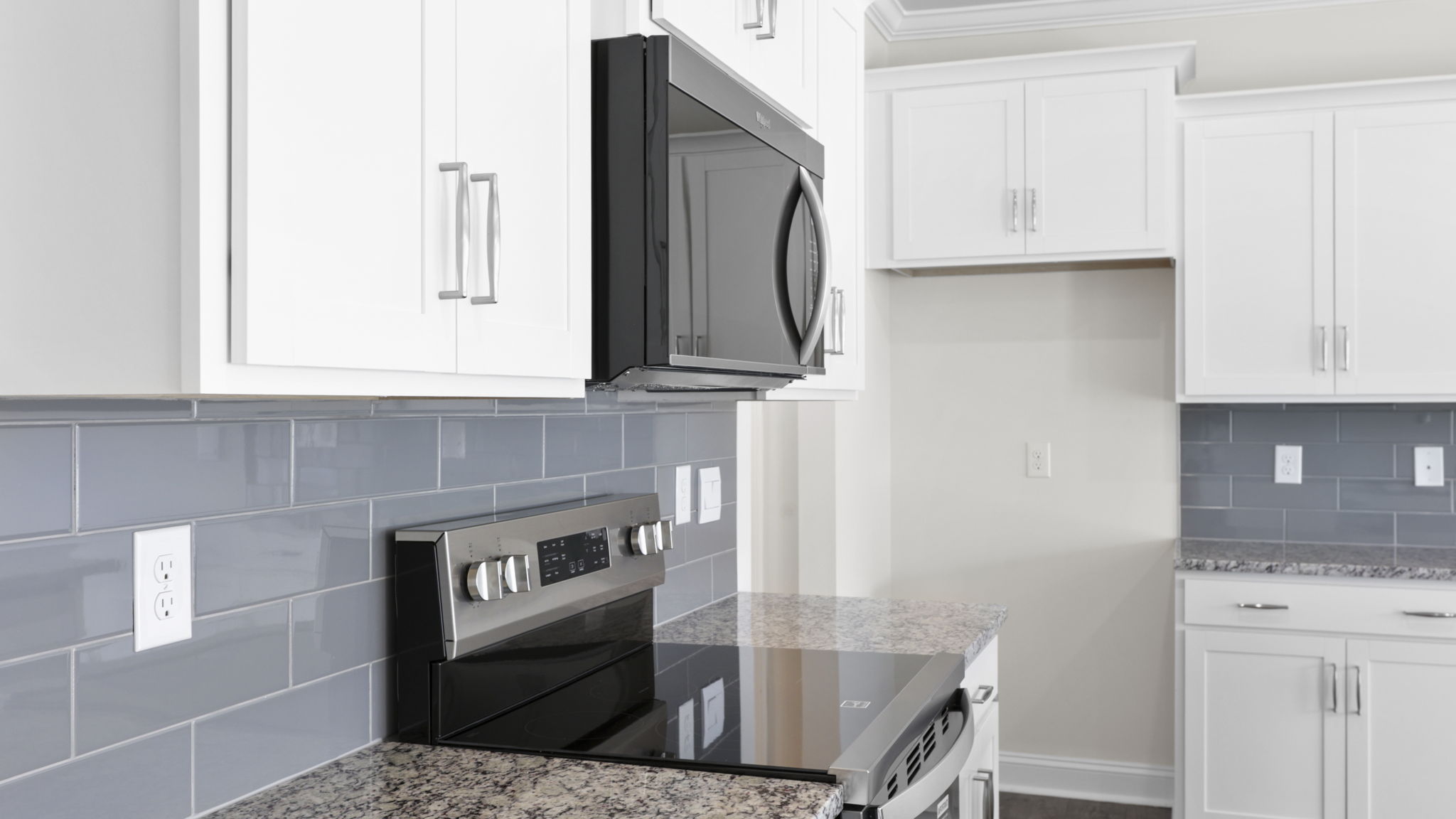 Open concept kitchen with large island and stainless steel appliances