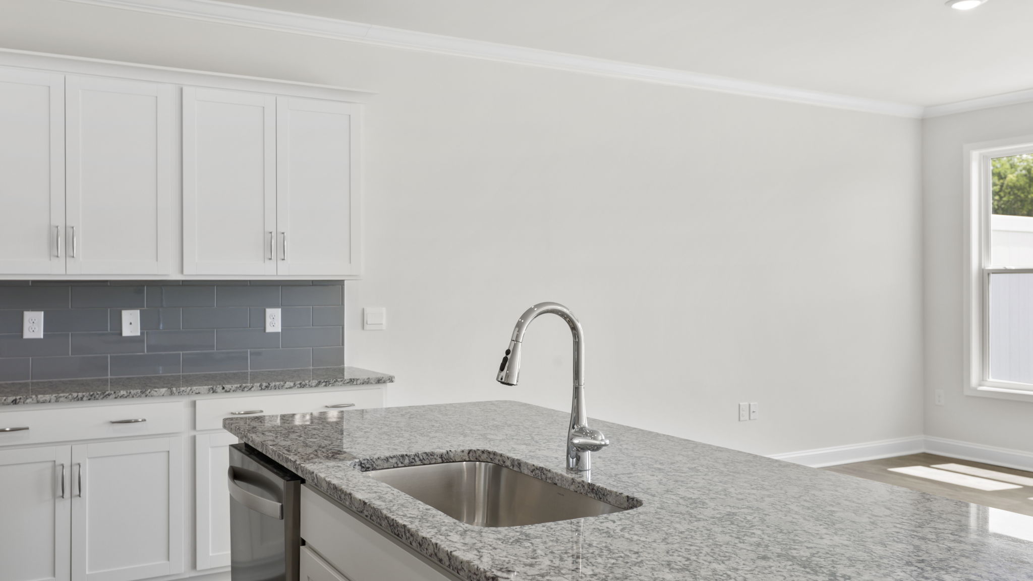 Open concept kitchen with large island and stainless steel appliances