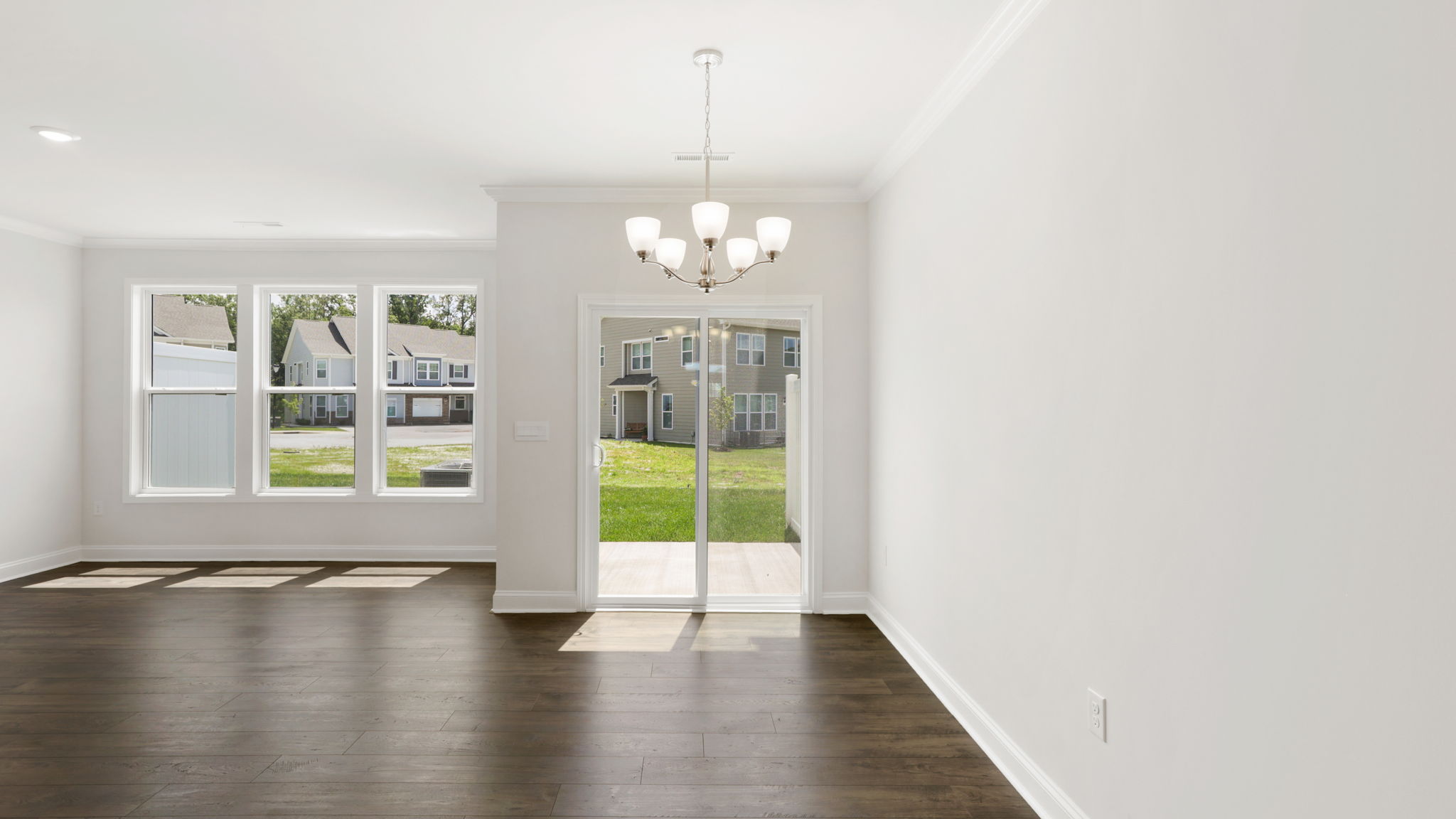 Open living space with sliding glass doors and large windows
