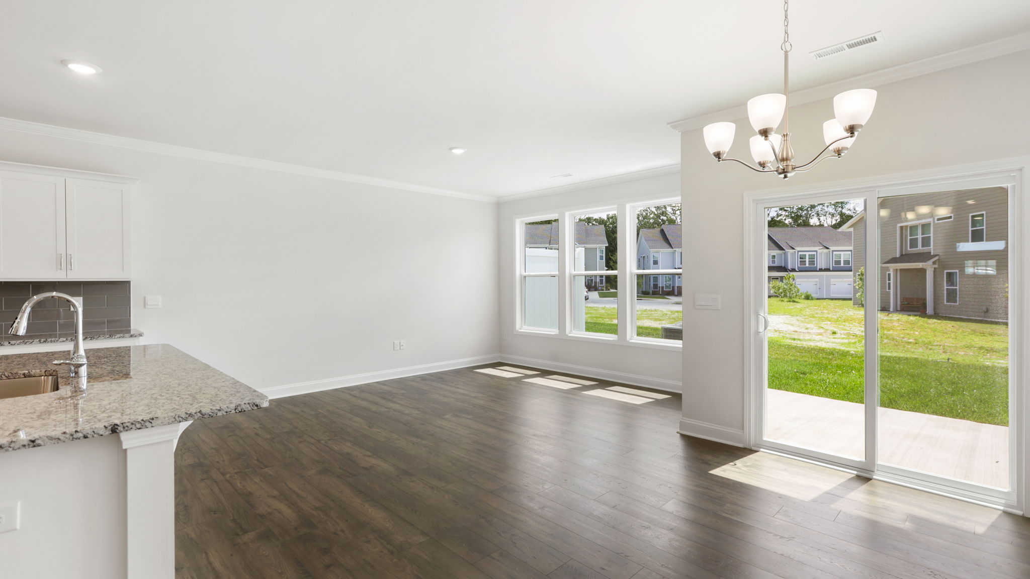 Open living space with sliding glass doors and large windows
