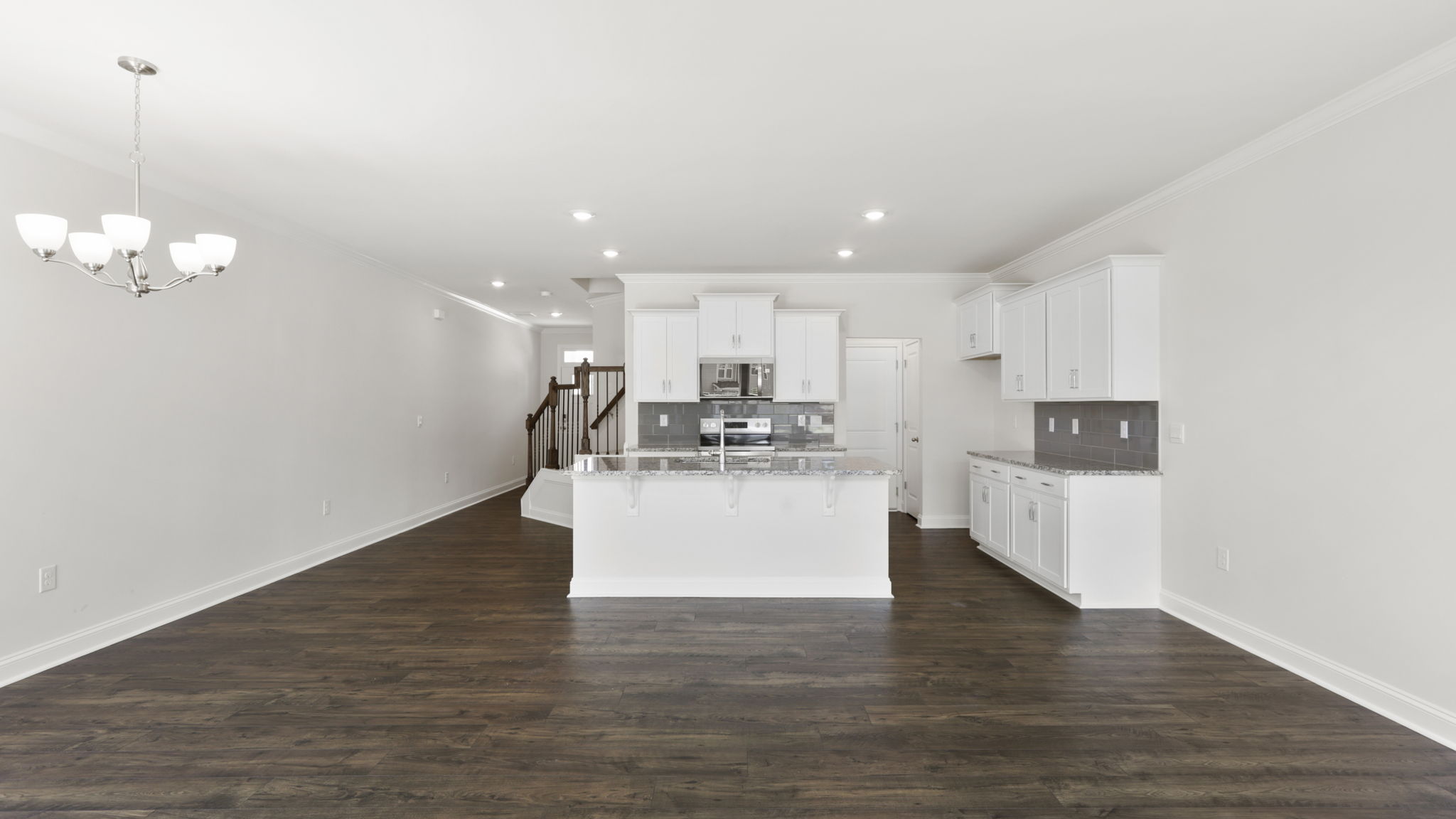 Open concept kitchen with large island and stainless steel appliances