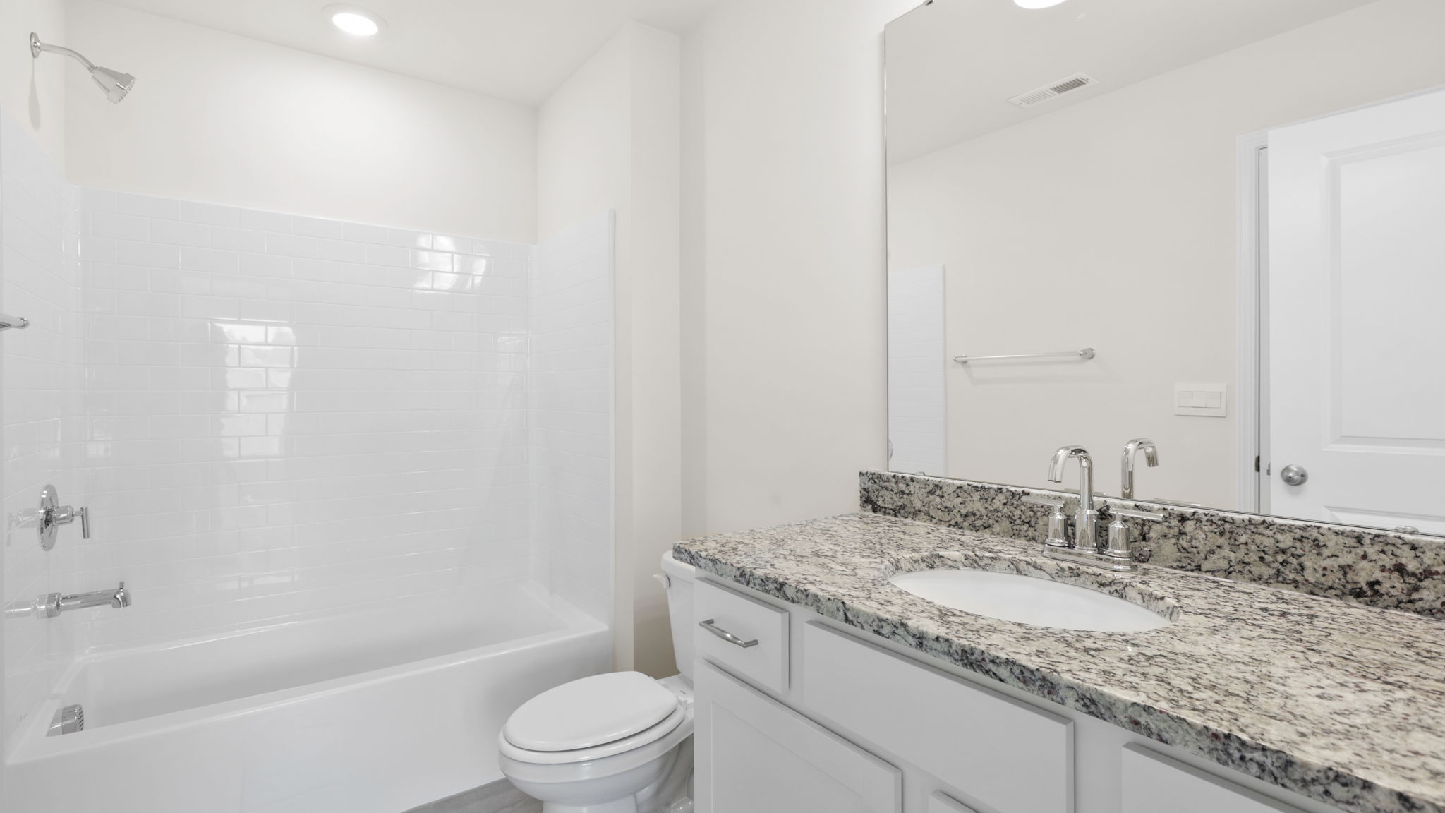 Bathroom with vanity and bathtub