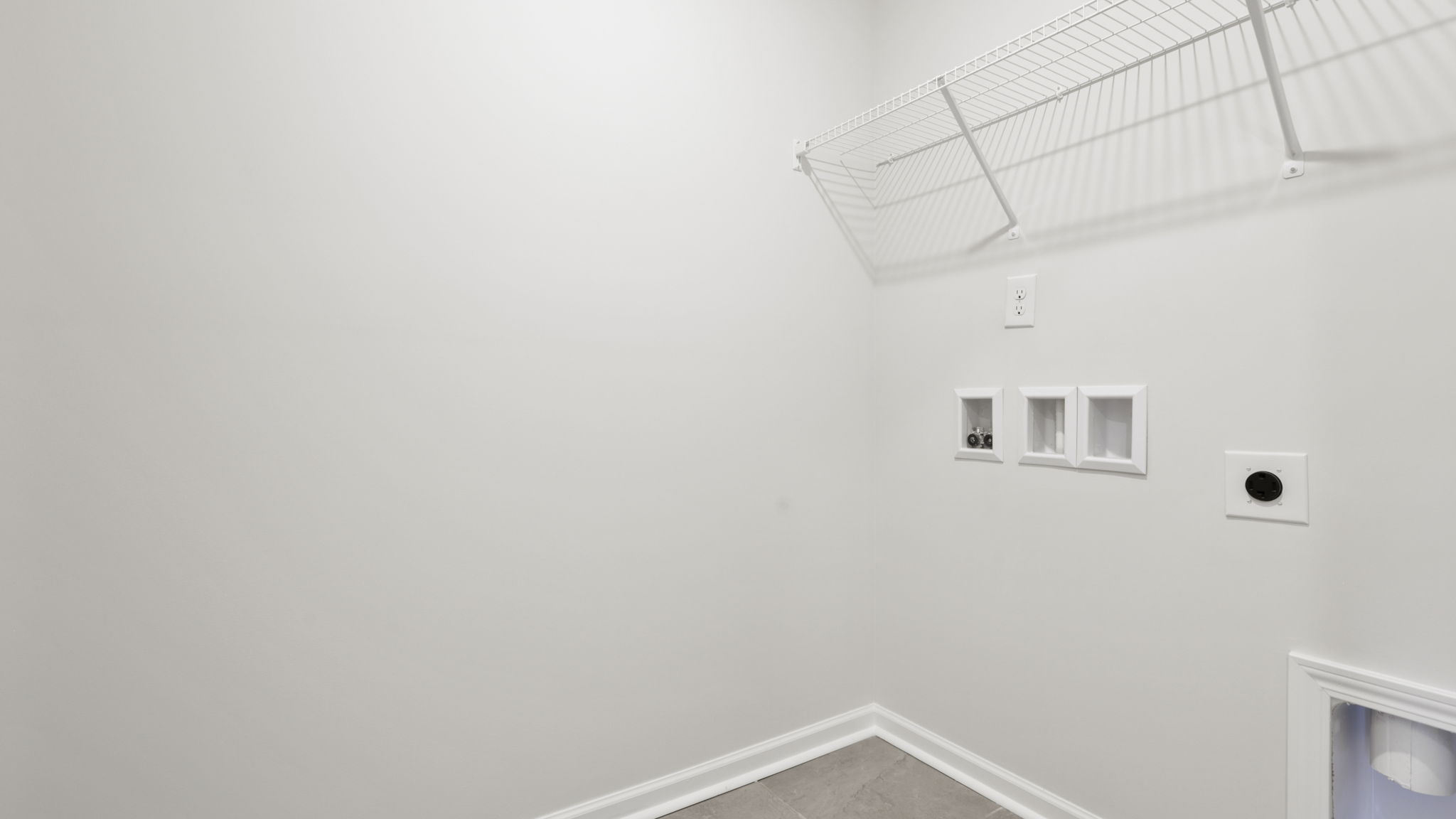 Laundry room with shelving