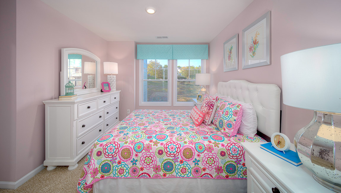 Carpeted bedroom with large window