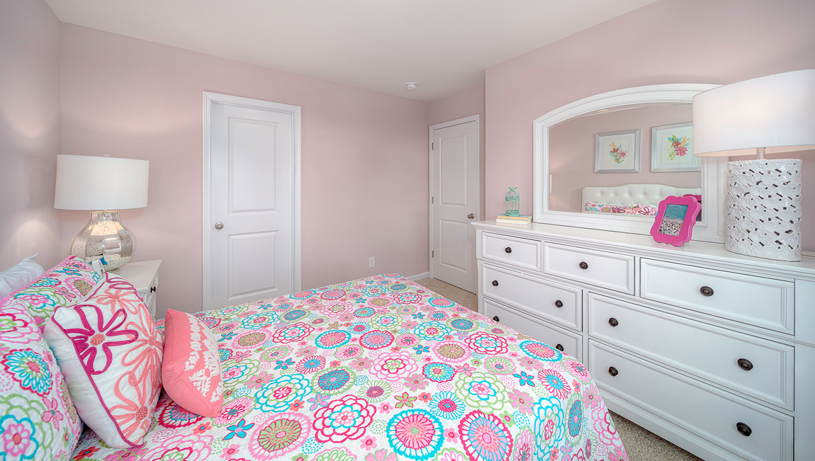 Carpeted bedroom with large window