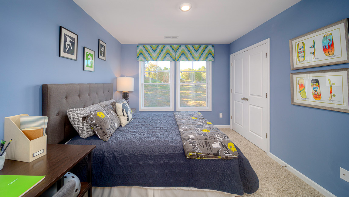 Carpeted bedroom with large window
