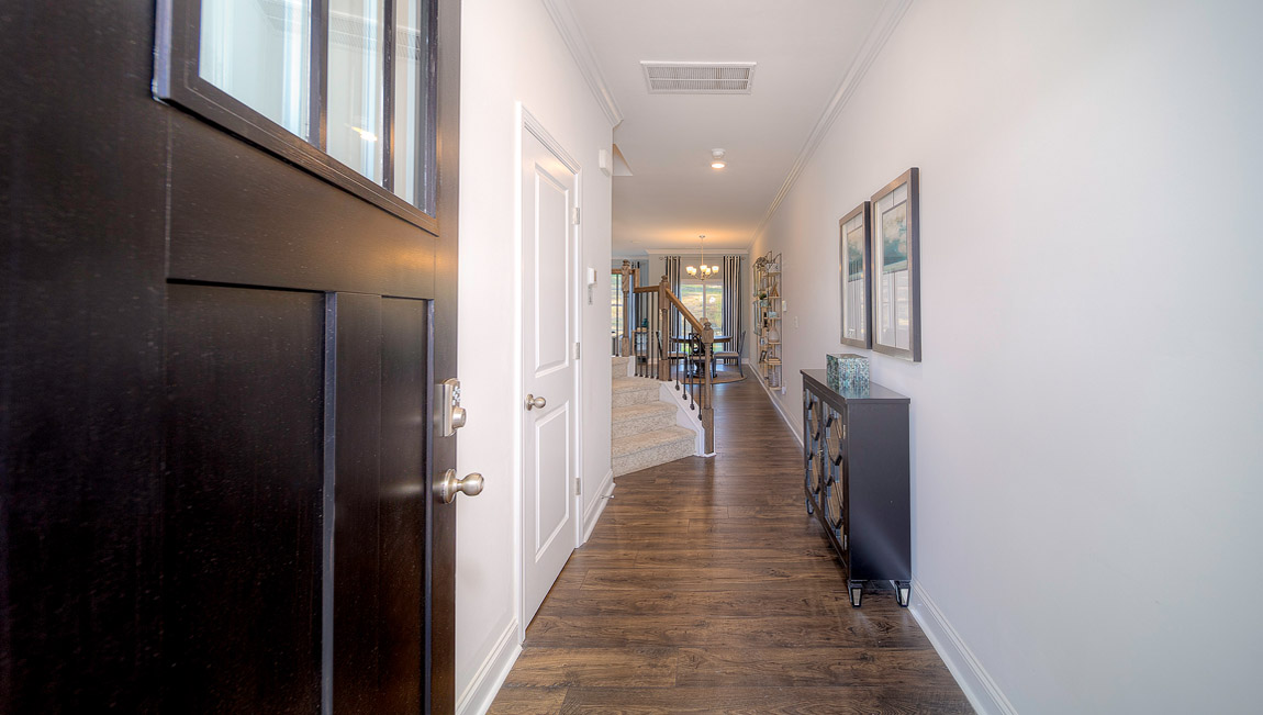 Welcoming foyer with wood floors and view of home interior