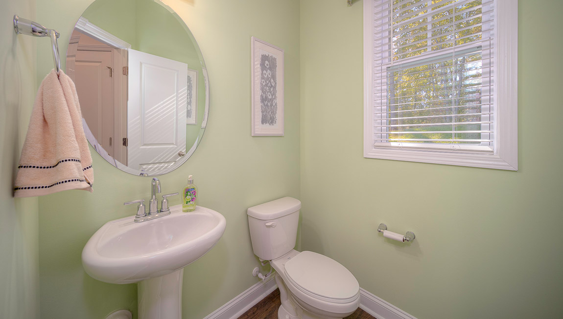Powder bathroom with sink and toilet