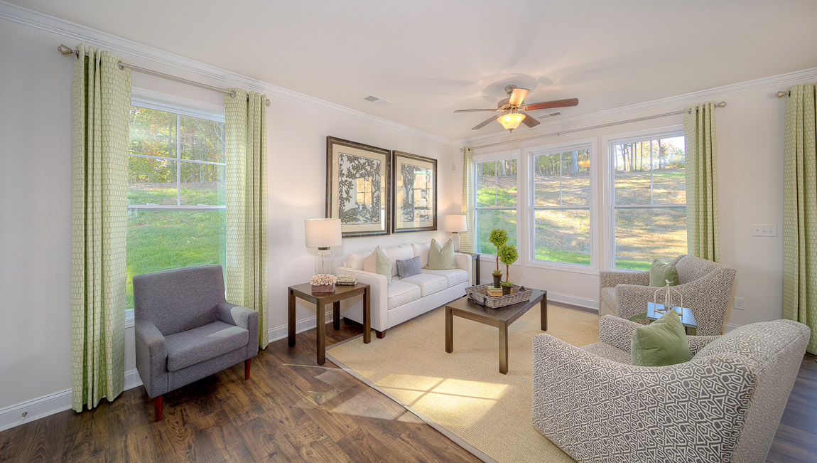 Dining room space with wood floors, beside sliding glass back door