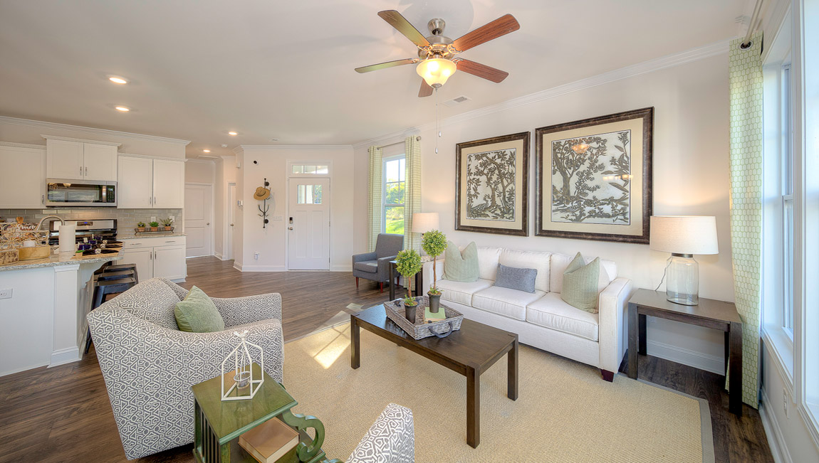 Dining room space with wood floors, beside sliding glass back door