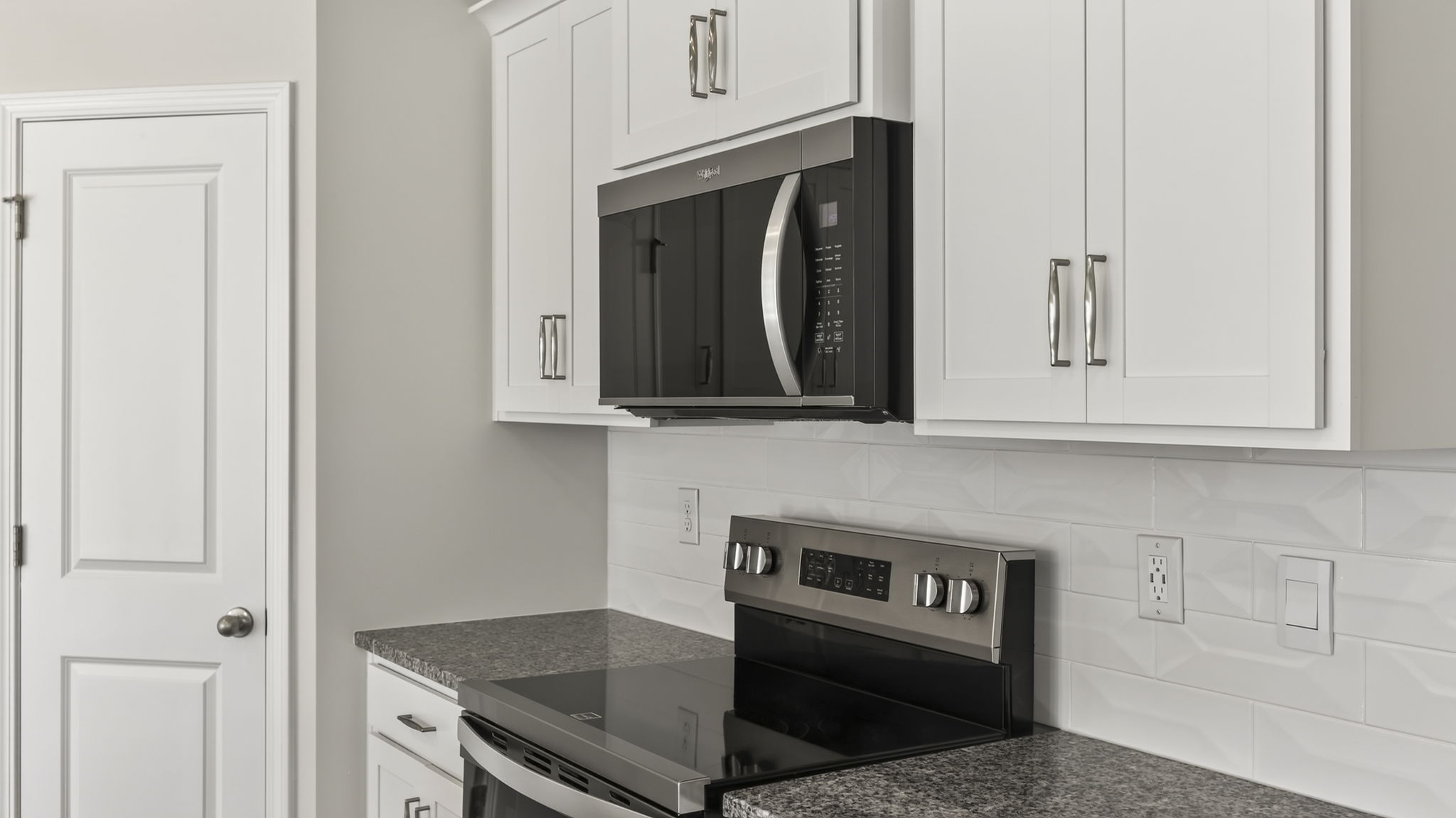 Open concept kitchen with large island and stainless steel appliances