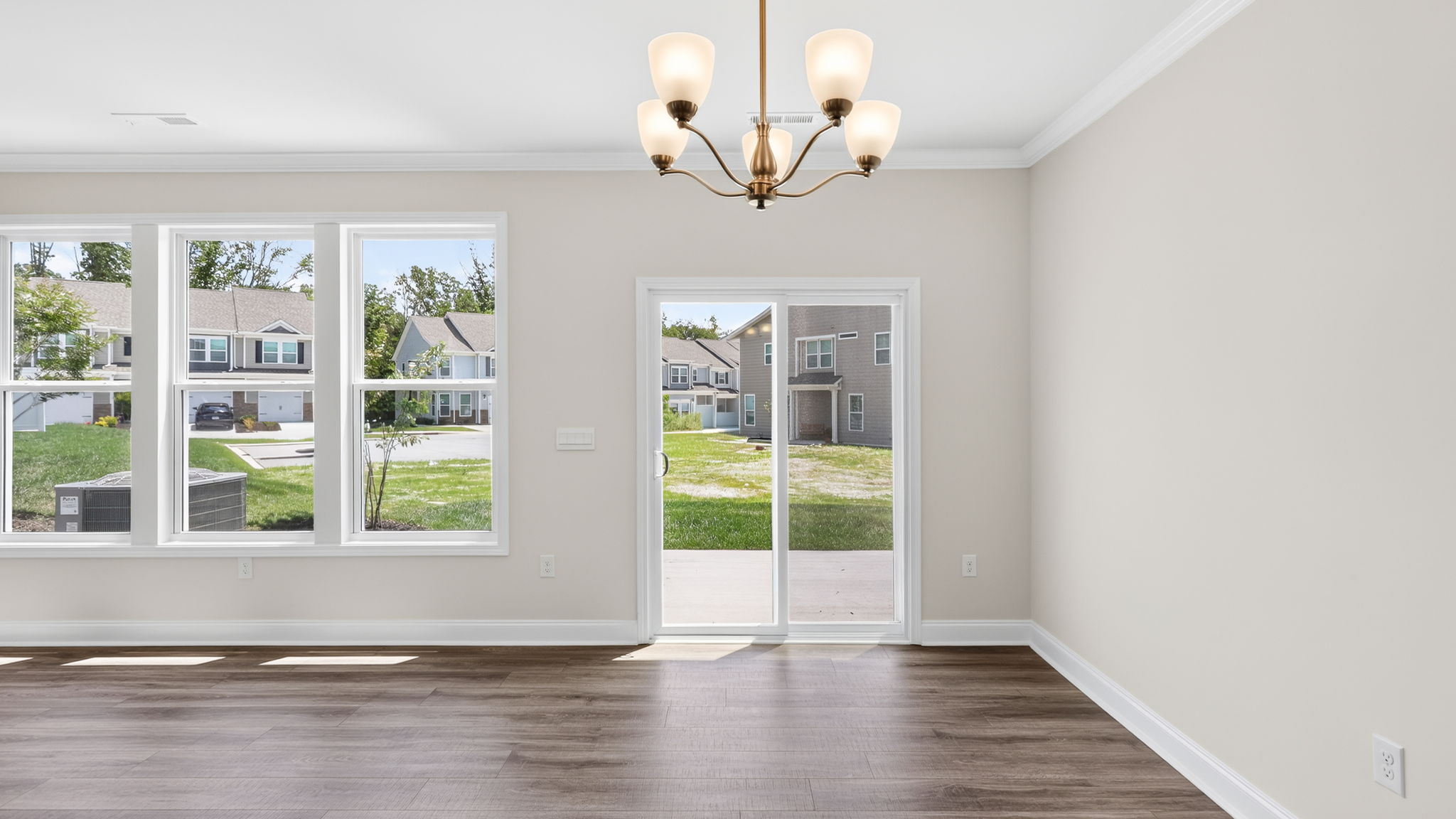 Open dining area with sliding glass doors to back patio