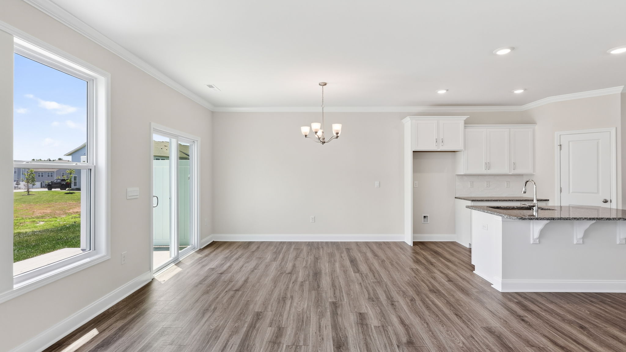 Open dining area with sliding glass doors to back patio