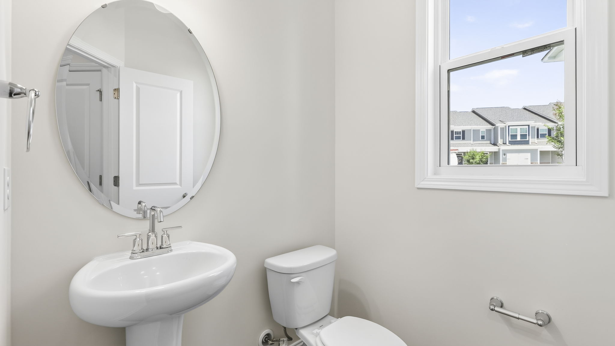 Half bathroom with single sink and mirror
