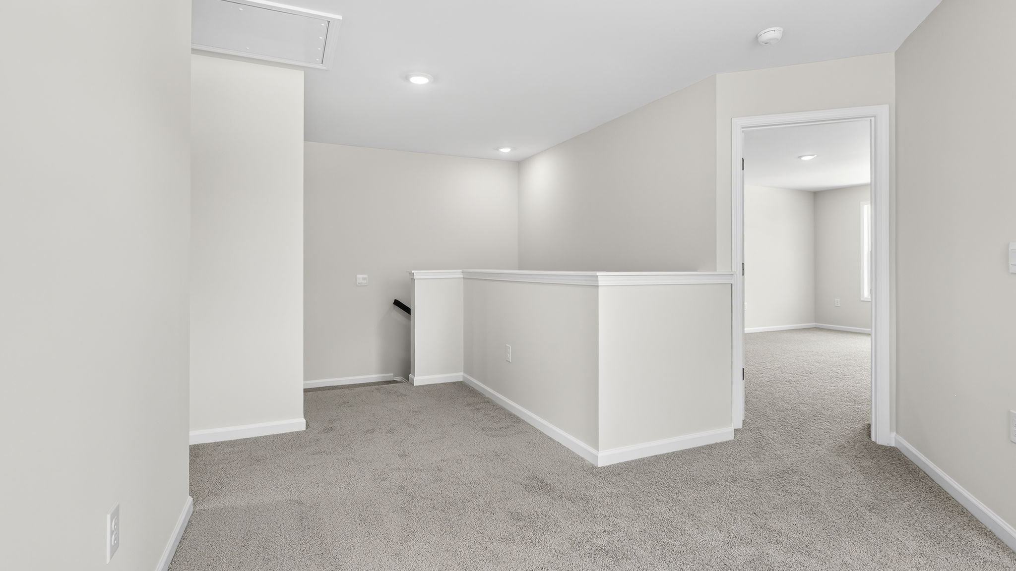 Carpeted upstairs loft