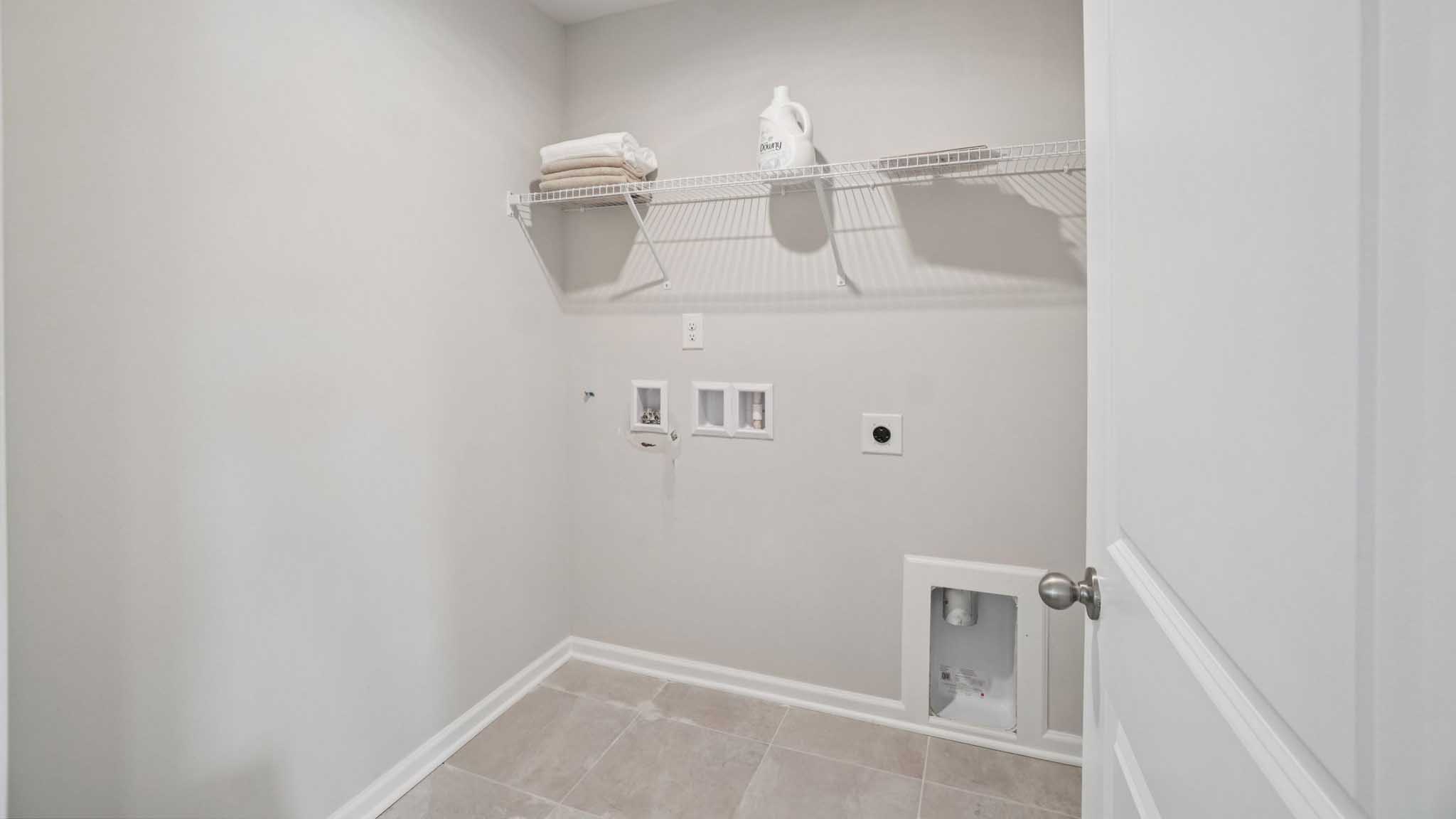 Laundry room with shelving