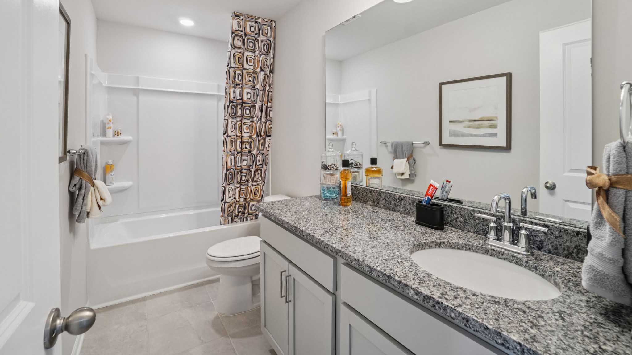 Bathroom with vanity and bathtub