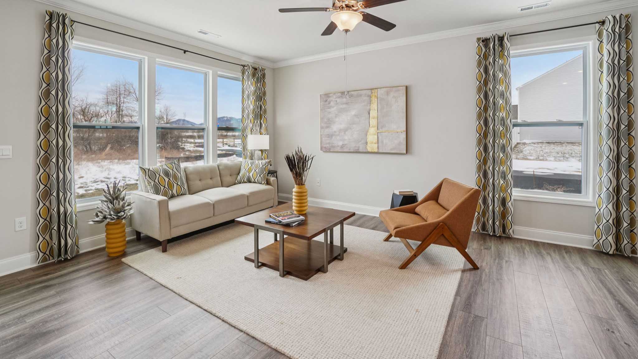 Open concept living space with large windows