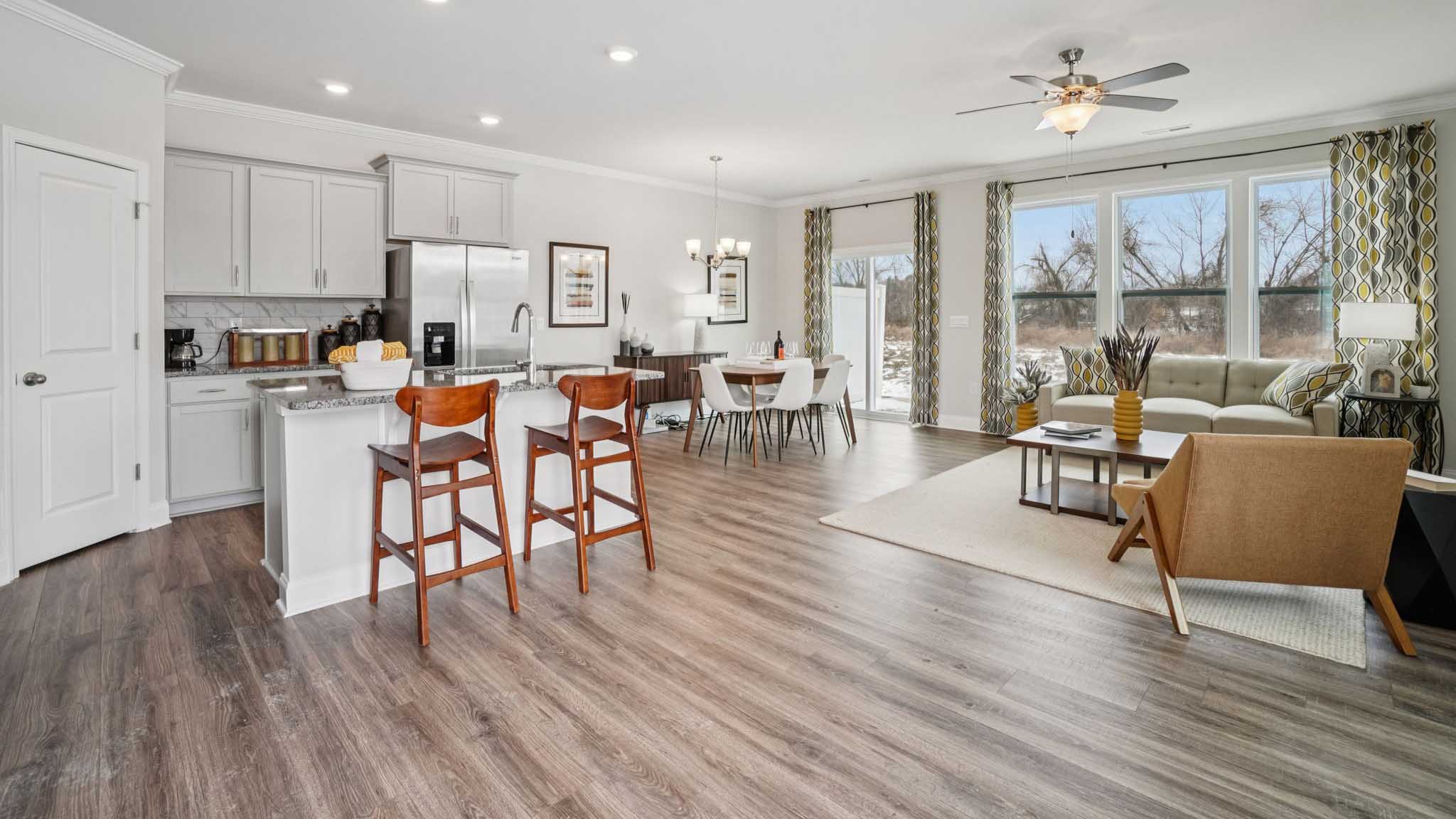 Open concept living space with large windows