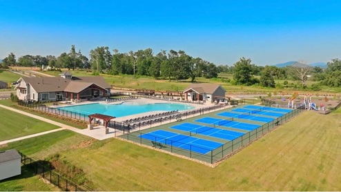 Over view of amenities with pool and pickeball court.