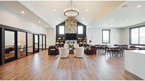 Clubhouse with a tv and fireplace.