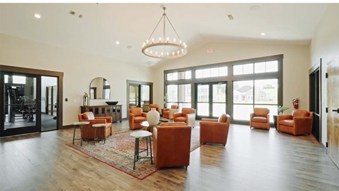 Spacious seating area inside of clubhouse.