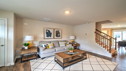 Family room with large window, view of stairs